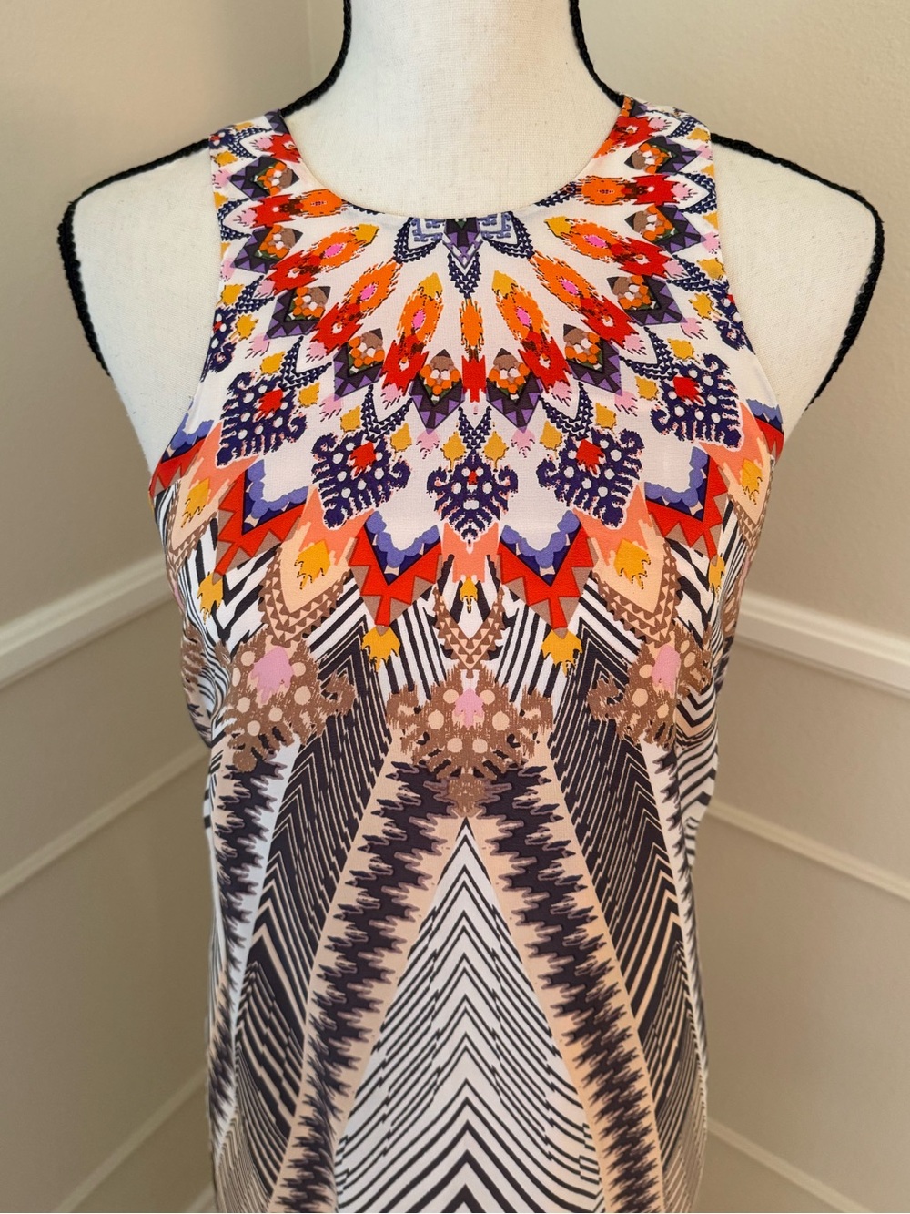 Vibrantly colorful, sleeveless silk dress.